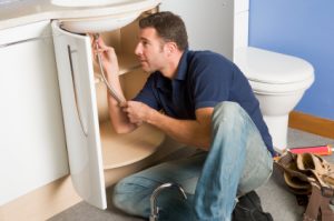 Homeowner Repairing Sink Homeowner Repairing Sink