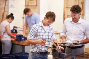 Trainer helping students