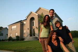 Family in front of home